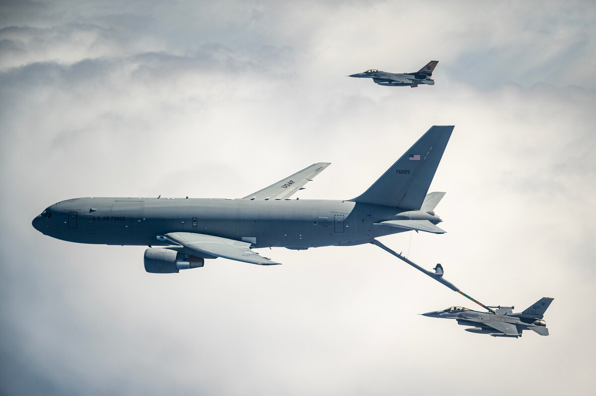 A U.S. Air Force KC-46 Pegasus, left, refuels a U.S. Air Force F-16 Fighting Falcon, right, over the Indo-Pacific.