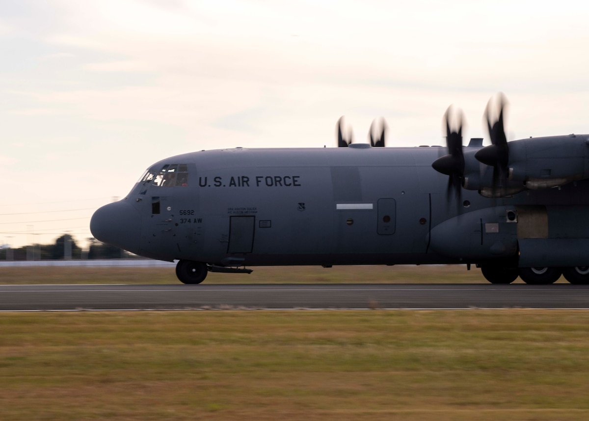 A plane prepares to take off down a runway.