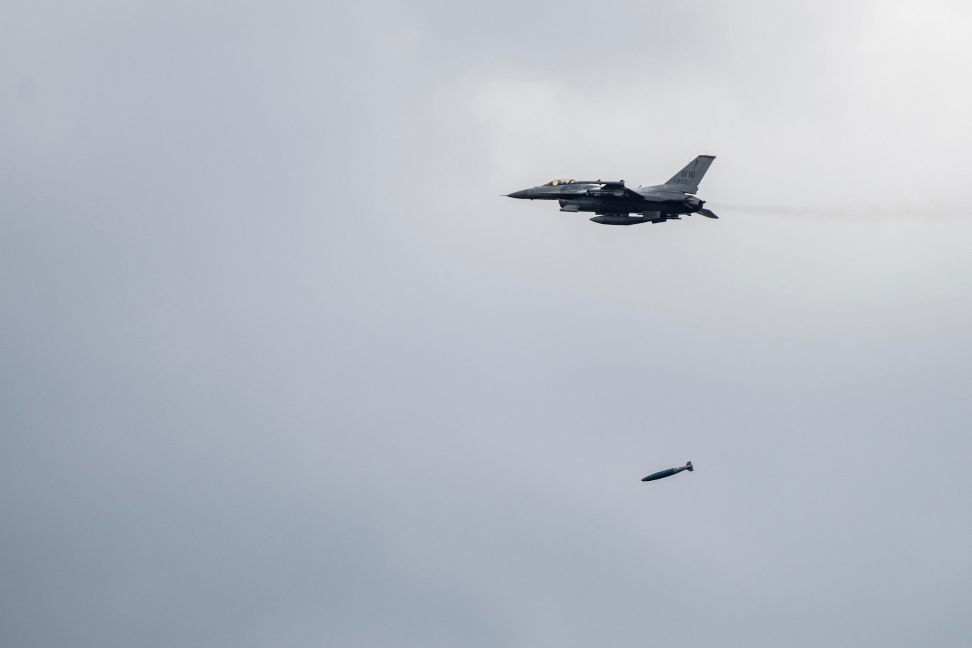 An F-16 Fighting Falcon deploys an ordnance during Misawa Range Day at Draughn Range, Japan, Oct. 20, 2023.