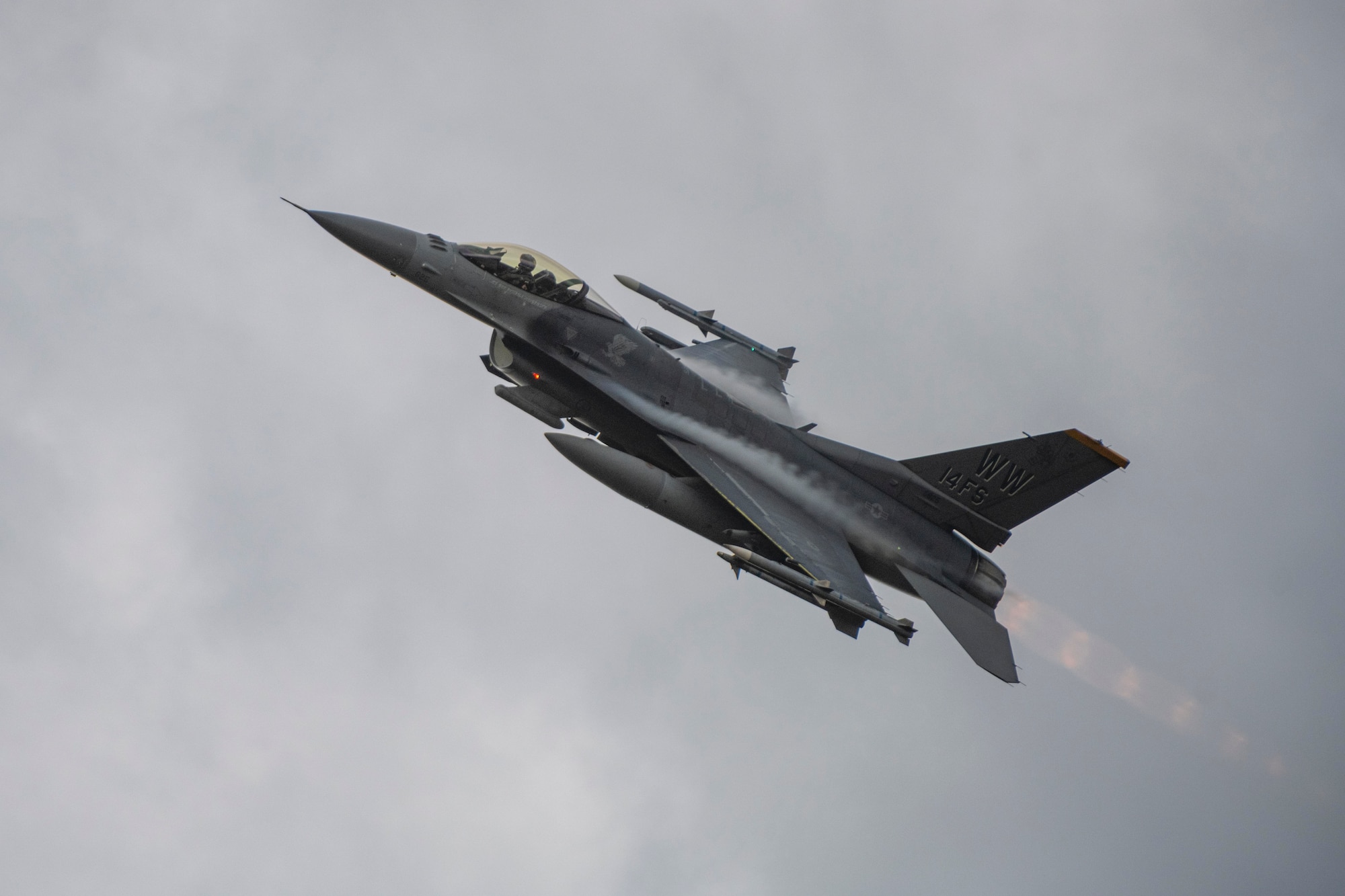 An F-16 Fighting Falcon flies upward after performing a strafing run during Misawa Range Day at Draughn Range, Japan, Oct. 20, 2023.