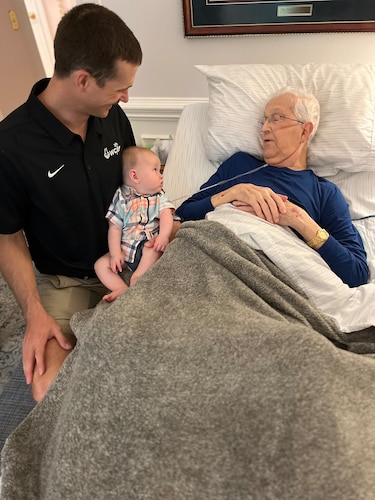 The Air Force World Class Athlete Program’s Airman 1st Class Daniel Michalski, left, introduces his son, Joseph Michalski, to his grandfather, also named Joseph Michalski, right, after completing Air Force Basic Training at Lackland Air Force Base, Texas. Daniel Michalski’s son was named after his grandfather, who he credits for being his greatest source of inspiration. (Courtesy photo)
