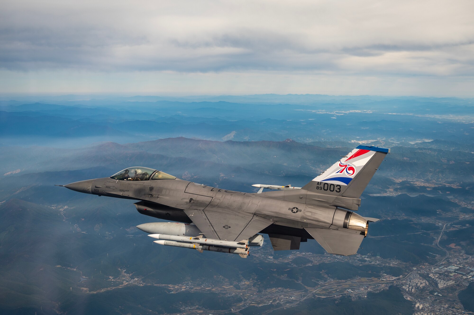 A U.S. Air Force F-16 Fighting Falcon soars over the southern coast of the Republic of  Korea.