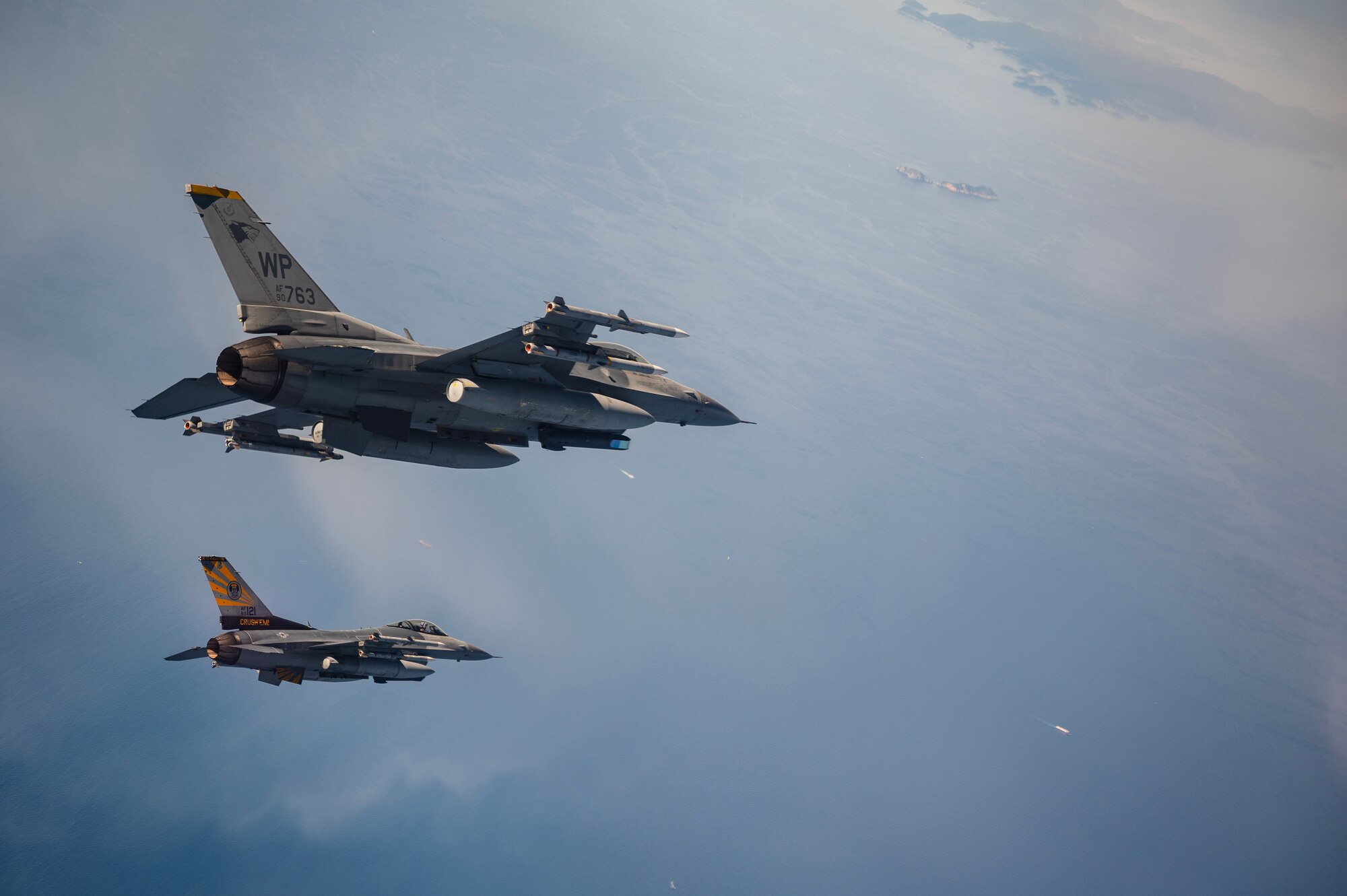 Two U.S. Air Force F-16 Fighting Falcons operate over the Indo-Pacific.