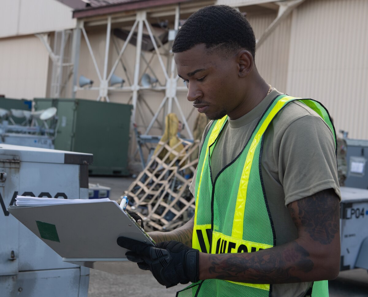 A Yokota Air Base Airman inspects cargo