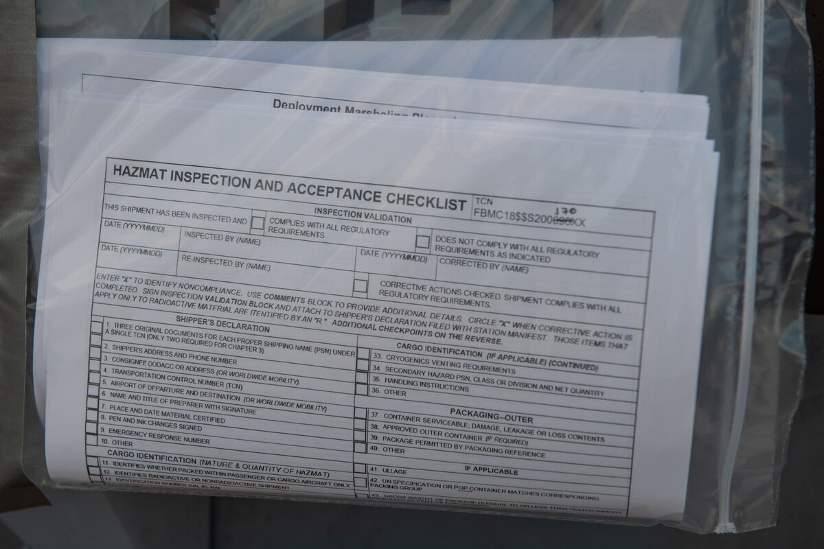 An inspection checklist is hung on the front of cargo at Yokota Air Base.