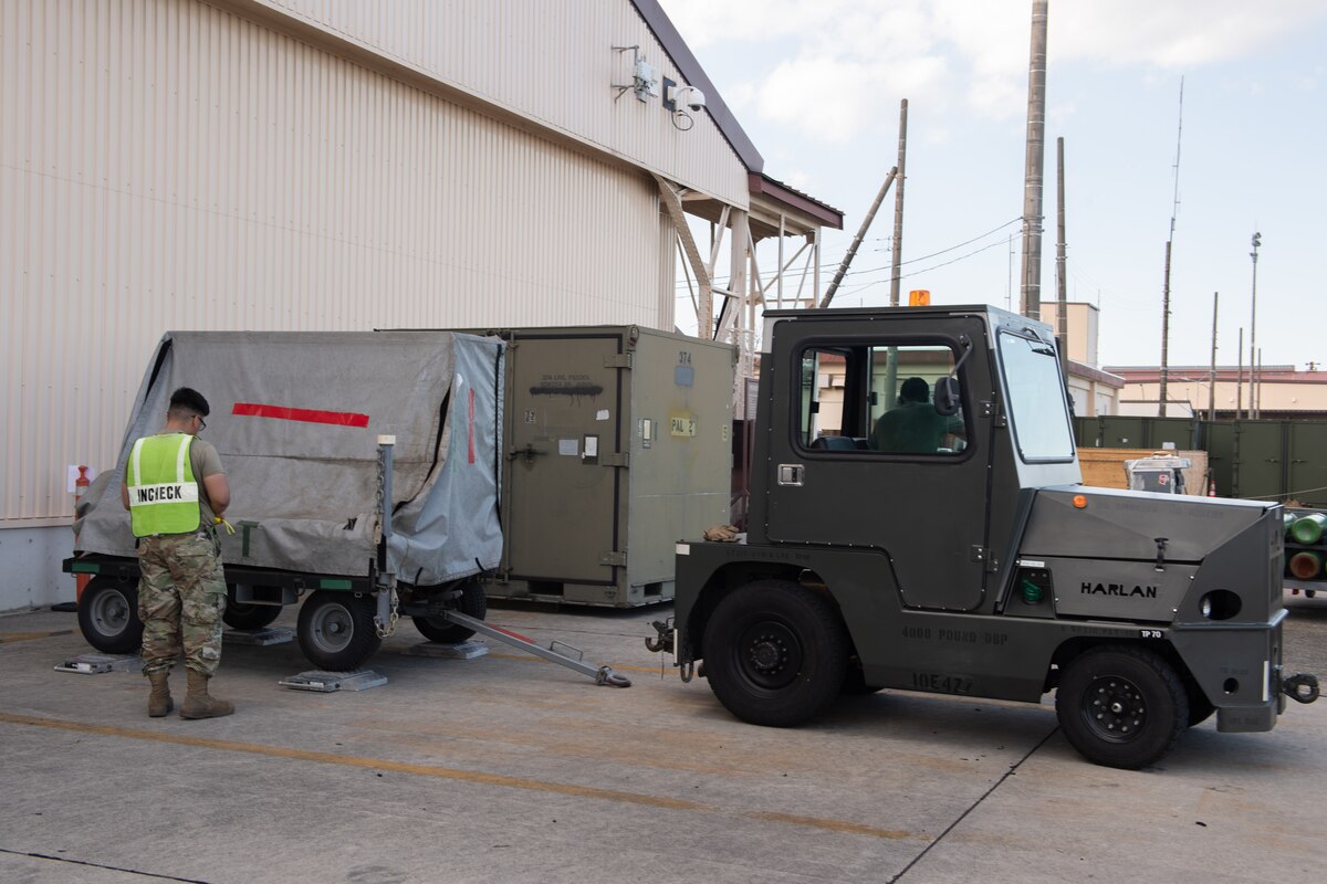 Yokota maintainers and port dawgs weigh cargo as part of exercise BM 24-1.
