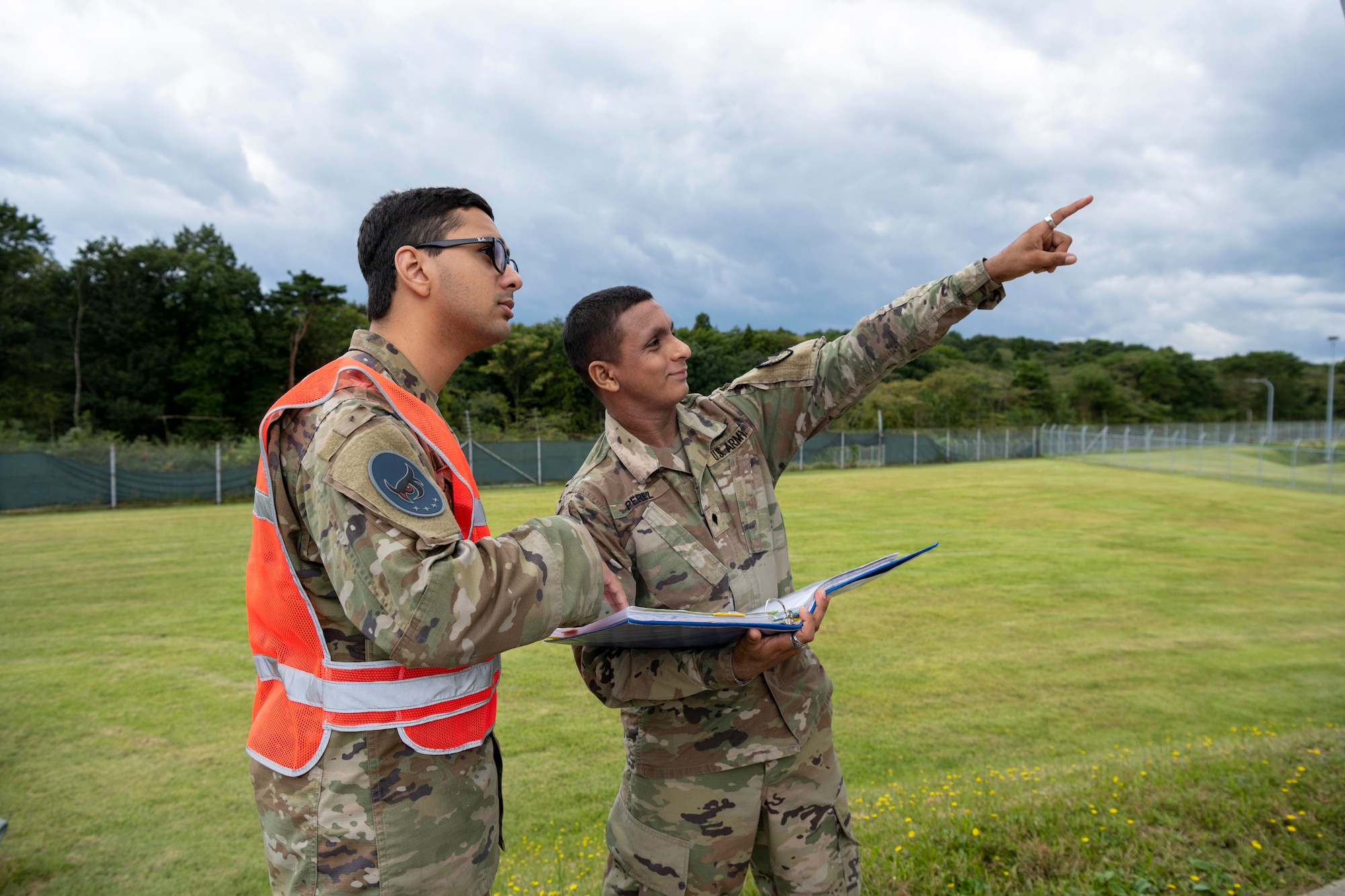 U.S. Space Force Specialist 4 Joshua Henriques, right, 5th Space Warning Squadron Joint Tactical Ground Station operator, and U.S. Army Specialist Jario Perez Martinez, left, 22nd Space Company operator, perform satellite checks at Misawa Air Base, Japan, Oct. 5, 2023.
