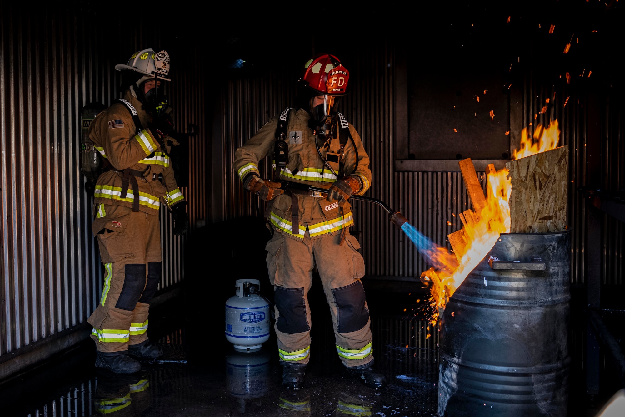 Firefighters start a fire for a training.