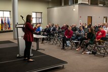 Photo of Dionne Bash presenting to her co-workers.