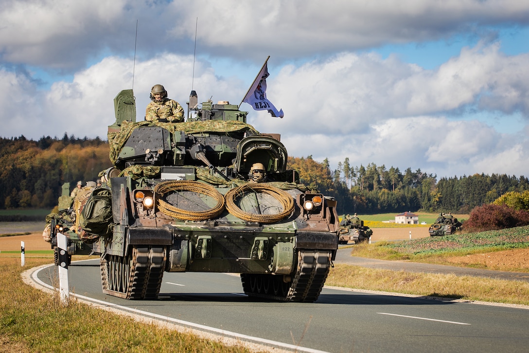 Soldiers conduct a tactical road march in a Bradley Fighting Vehicle.