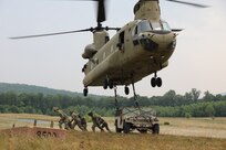U.S. Soldiers with Delta Company, 2-104th General Support Aviation Battalion, 28th Expeditionary Combat Aviation Brigade conduct sling load training at Fort Indiantown Gap, June 6, 2023. (U.S. Army National Guard Photo by 2nd Lt. Kate Kramer)