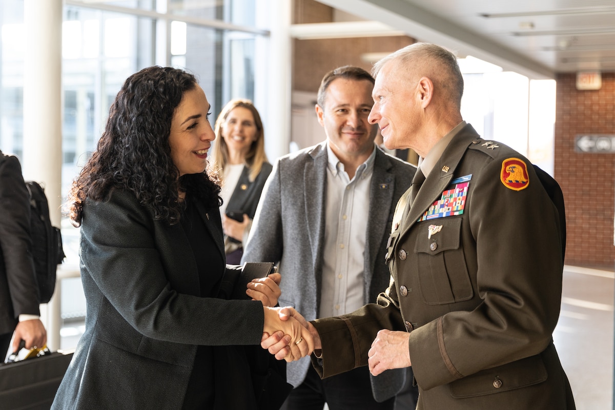 Kosovo President Vjosa Osmani is greeted by Maj. Gen. Stephen Osborn, the adjutant general of Iowa, at Des Moines International Airport Oct. 24, 2023. Osmani met Iowa National Guard leaders, toured Camp Dodge in Johnston and spoke at a formal reception at the Iowa State Capitol.