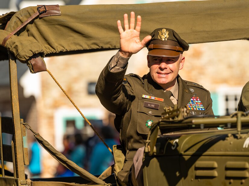 Maj. Gen. Kline waves to the crowd during the parade
