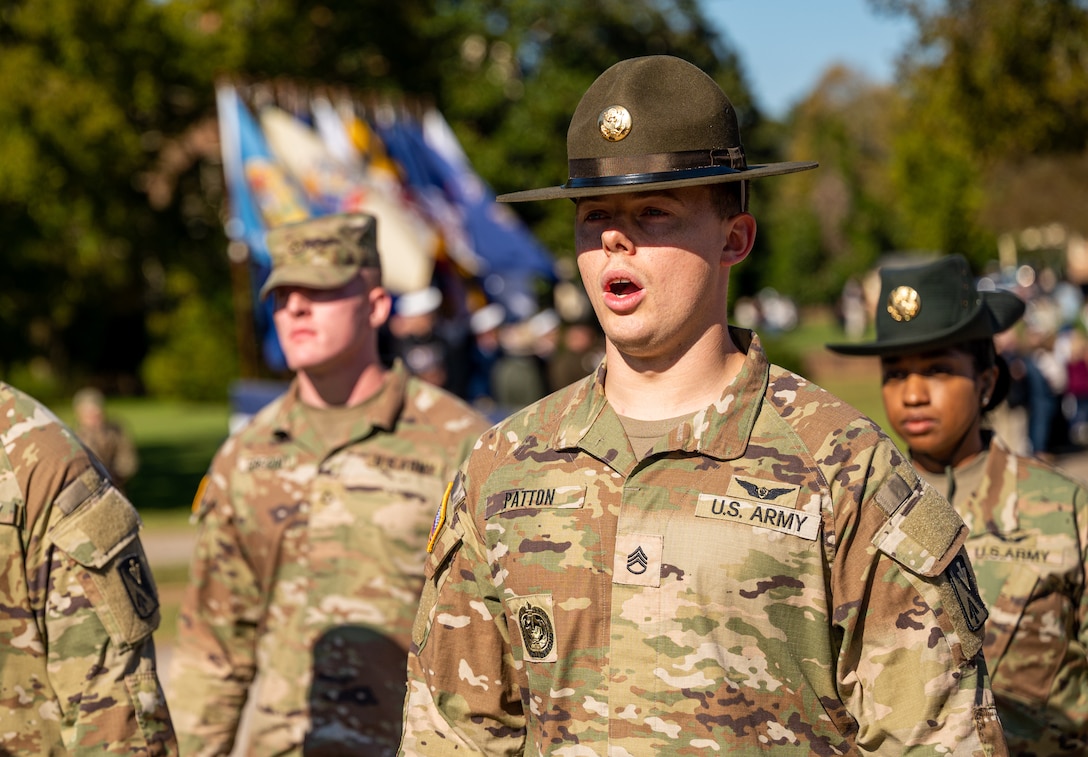 An Army drill sergeant marches a flight