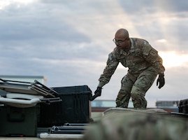 U.S. Army Soldier assigned to Signal Company, Headquarters and Headquarters Battalion, 1st Infantry Division, loads equipment at a training site on Fort Riley, Kansas, Oct. 24, 2023. Elements belonging to the 1st Inf. Div.’s Headquarters and Headquarters Battalion, Sustainment Brigade, Signal Company and Division Artillery, broke down the site to relocate during the initial stages of Danger Ready II, a series of ongoing exercises designed to prepare Soldiers for an upcoming multinational Warfighter exercise, on Fort Riley, Kansas. (U.S. Army photo by Spc. Charles Leitner)