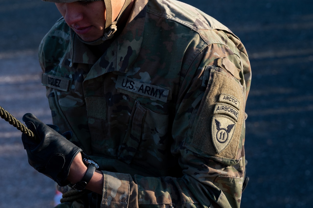 A uniformed service member participates in rappel training.