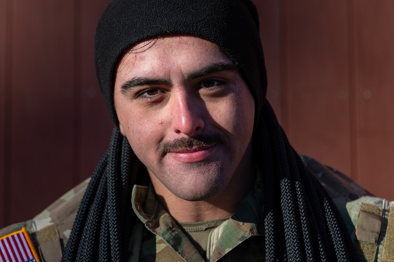 A uniformed service member poses for a close-up.