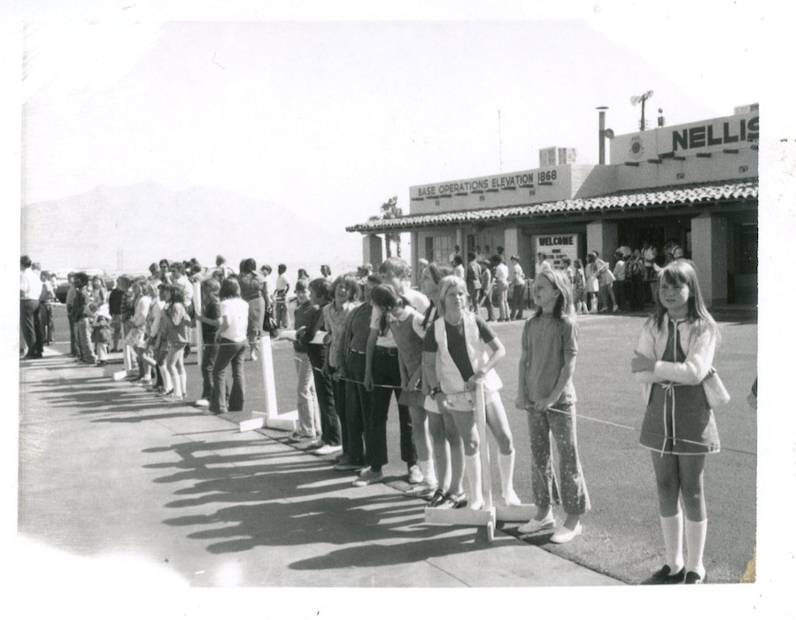 Students lined up outside Base Ops on the Nellis Air Force Base airfield, undated.