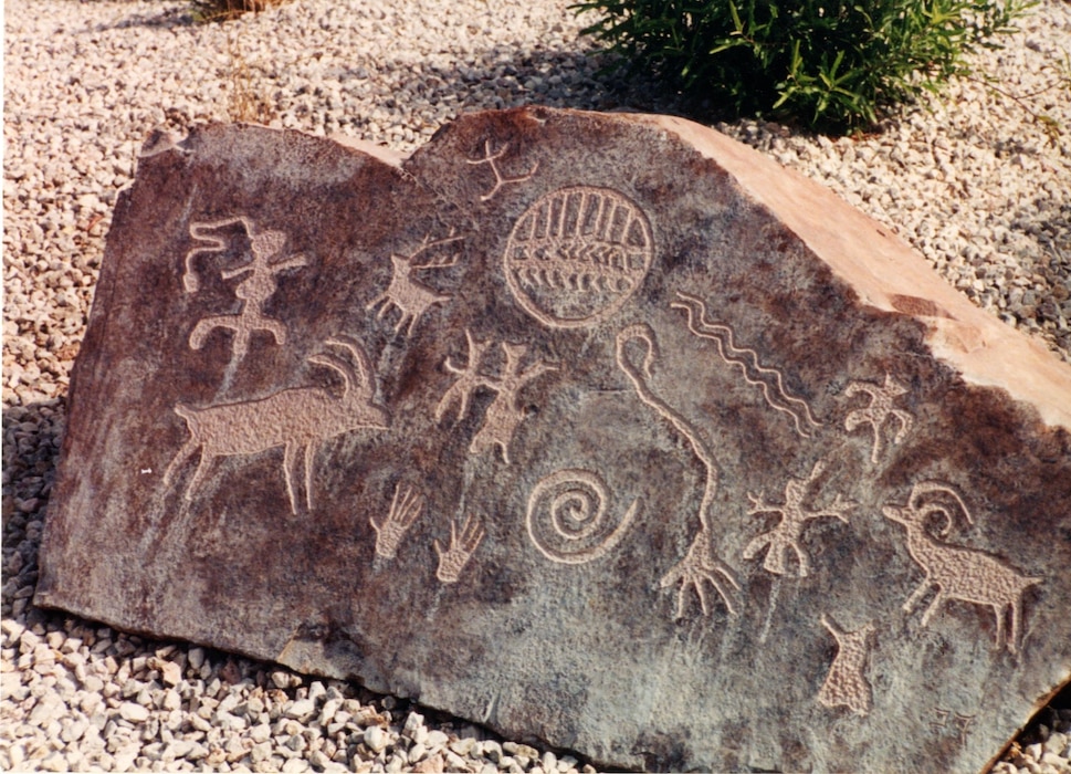 Monument petroglyph (synthetic) rock in front of the school, 2017.