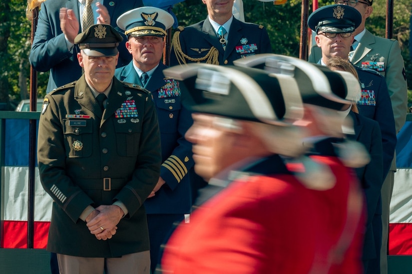 U.S. Army Maj. Gen. John D. Kline, Center for Initial Military Training commanding general, observes the passing parade from the reviewing stand during Yorktown Day, Oct. 19, 2023, Yorktown, Virginia. All branches of the military, patriotic organizations, and the U.S. Army Old Guard Fife and Drum Corps, were represented during the event. (U.S. Air Force photo by Airman 1st Class Ian Sullens)