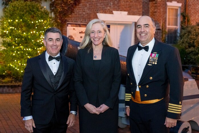 IMAGE: Naval Surface Warfare Center Dahlgren Division (NSWCDD) Technical Director Dale Sisson Jr., SES, and Capt. Philip Mlynarski, commanding officer, stand with Rep. Abigail Spanberger during the meet and greet portion of the NSWCDD Dahlgren Downtown Forging Community Partnerships event held at the Silk Mill in Fredericksburg Oct. 20. Spanberger served as the event’s keynote speaker.