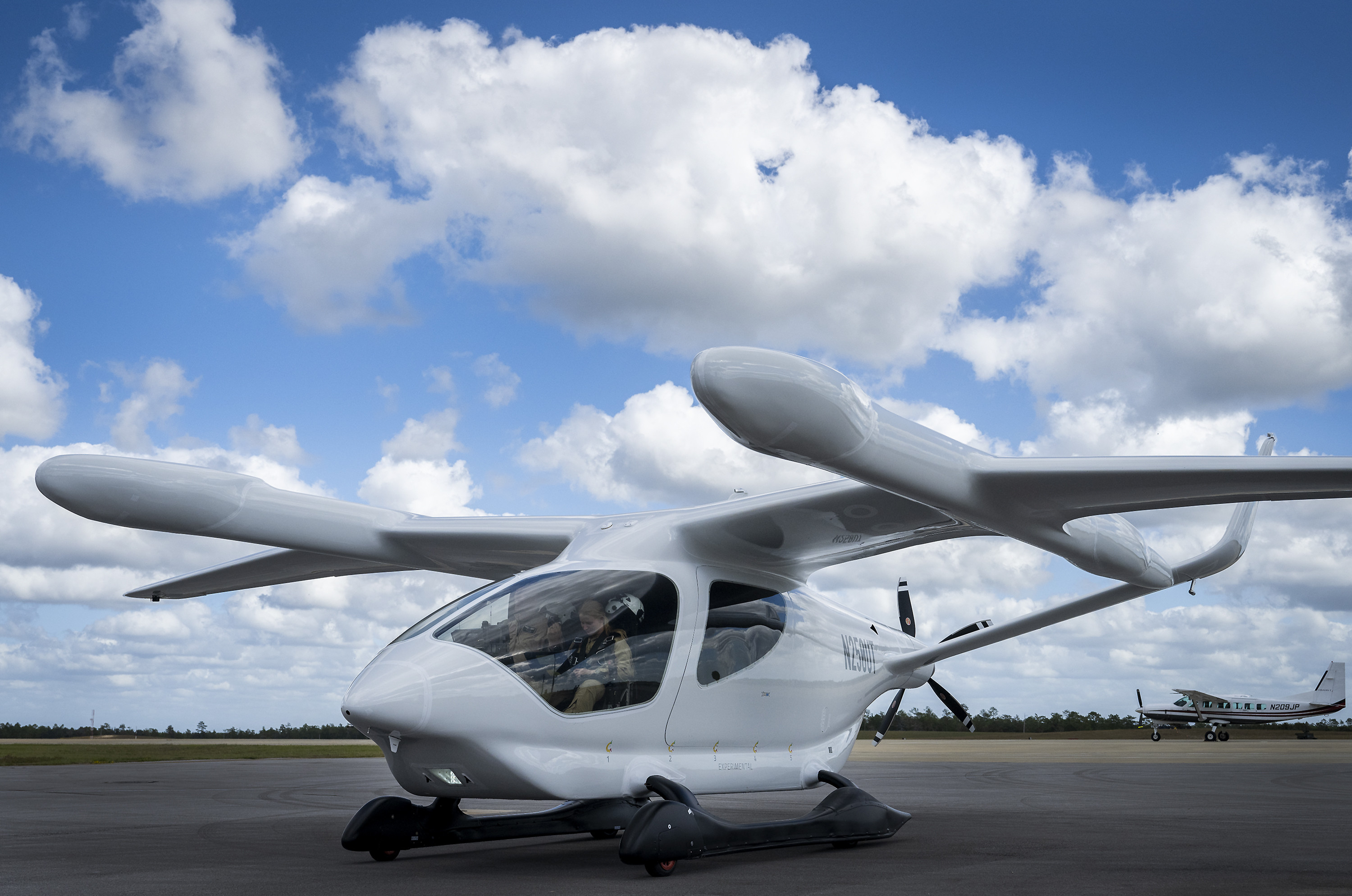 BETA’s ALIA electric aircraft has a 50-foot wingspan, a range of 250 miles with a top speed of 138 mph and is 90% quieter than a helicopter. While ALIA has the capability to transport five passengers, the Air Force test objective is to demonstrate its potential to support agile combat employment logistics with its payload capacity of 1,000 pounds. (U.S. Air Force photo by Samuel King Jr.)