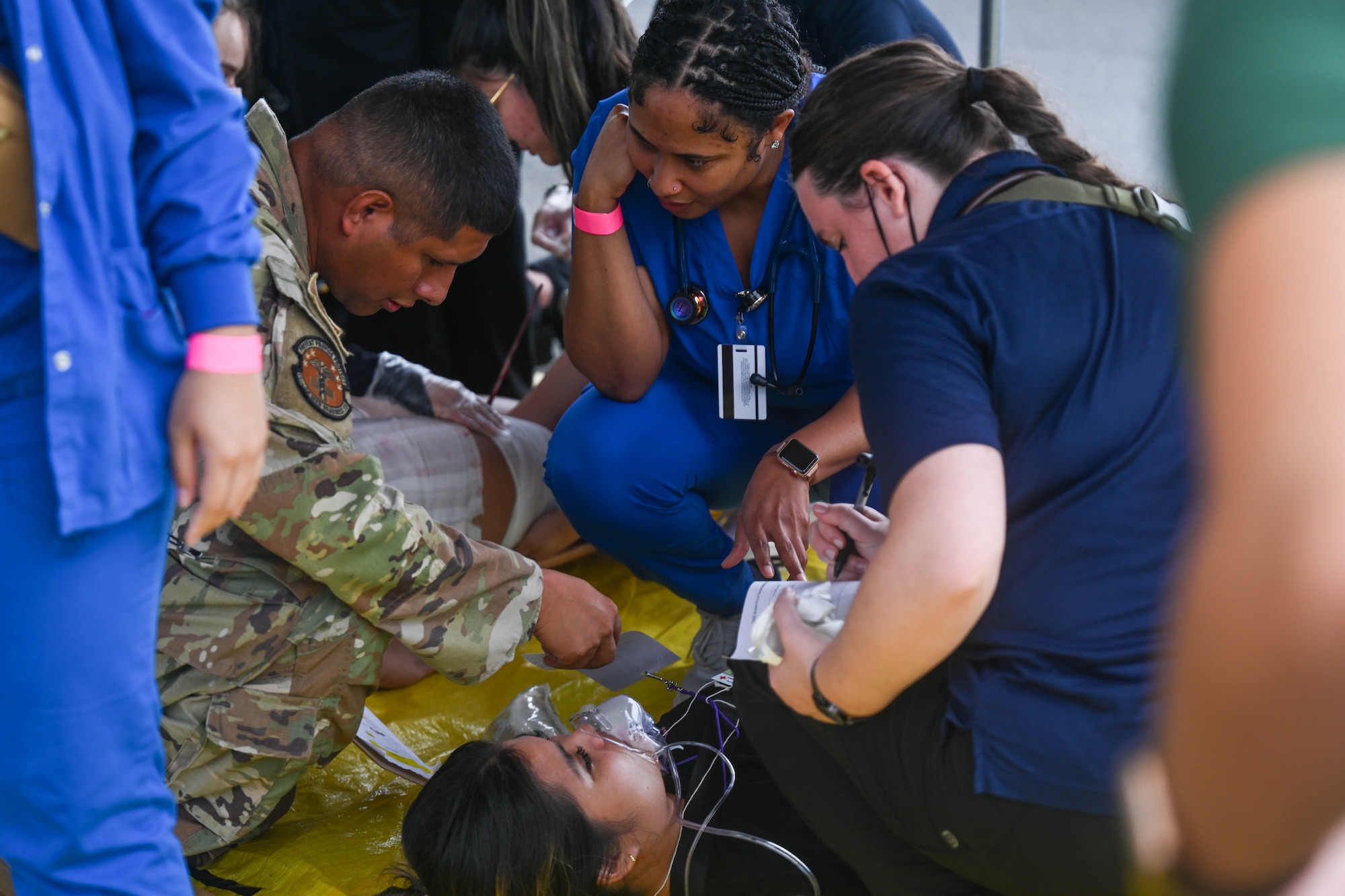 Staff Sgt. Richard Rodriguez, 15th Operational Medical Readiness Squadron warrior operational medicine noncommissioned officer in charge, coaches nursing students during a triennial airport disaster exercise at Daniel K. Inouye International Airport, Oct. 20, 2023. The airport served as a staging area for an emergency response exercise that consisted of Hickam Airmen, first responders, nursing students from across the state of Hawai`i and Coast Guardsmen responding to a disaster scene to triage and treat simulated patients. 

(U.S. Air Force photo by Senior Airman Makensie Cooper)