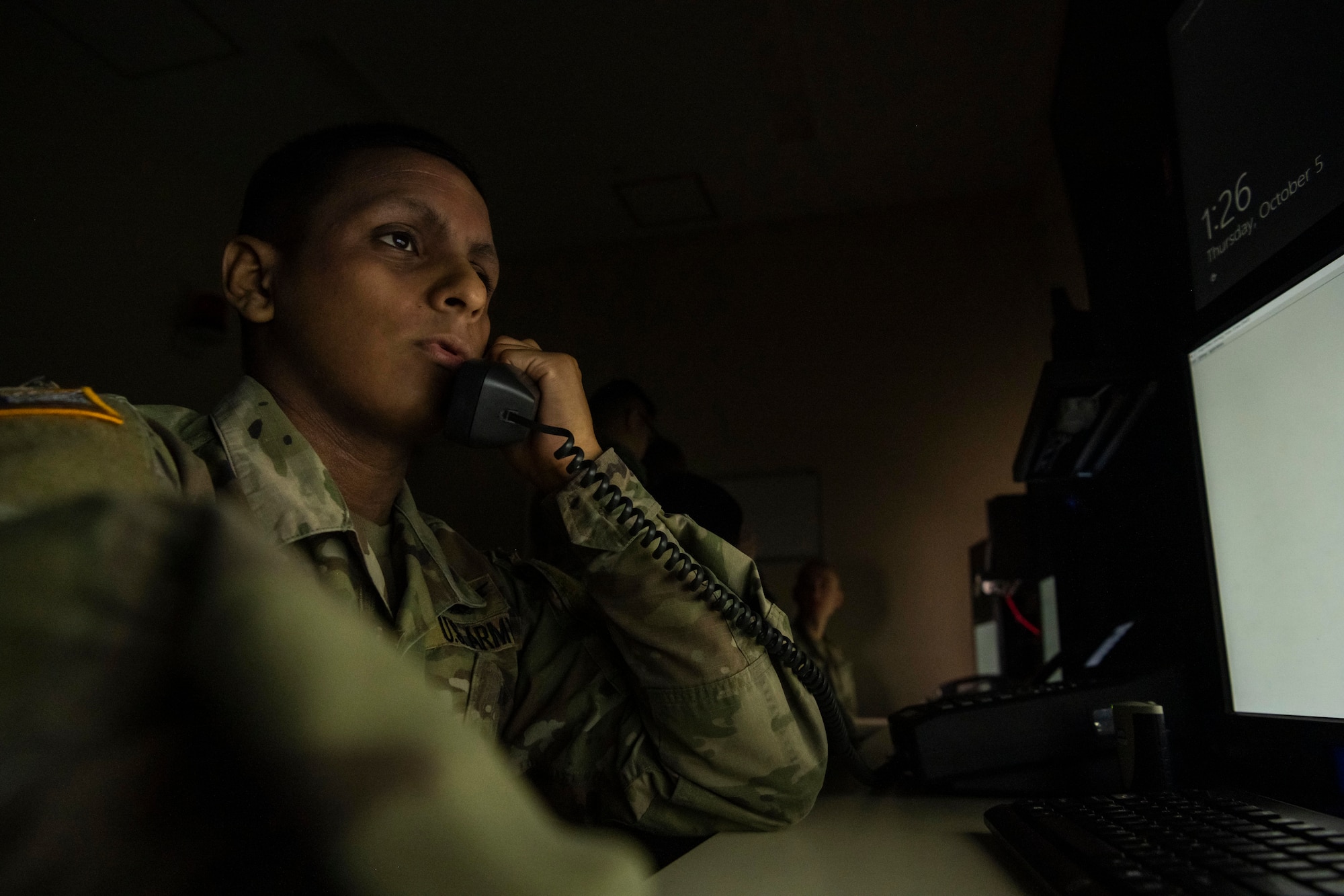 U.S. Army Specialist Jario Perez Martinez, 22nd Space Company operator, answers calls at Misawa Air Base, Japan, Oct. 5, 2023.