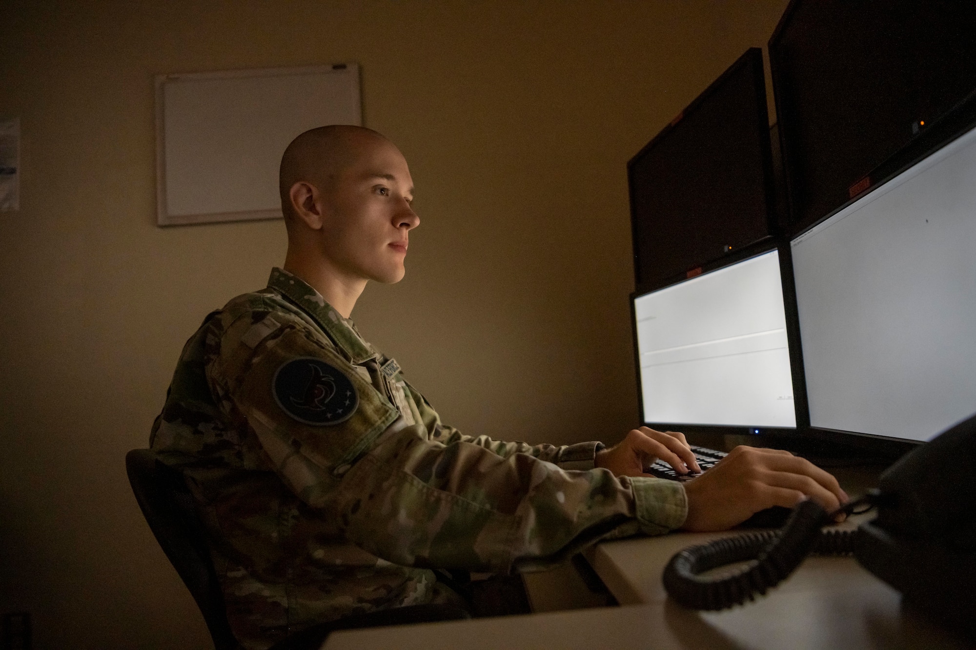 U.S. Space Force Sgt. Evan Knight, 5th Space Warning Squadron Joint Tactical Ground Station (JTAGS) crew chief, checks reports at Misawa Air Base, Japan, Oct. 5, 2023.