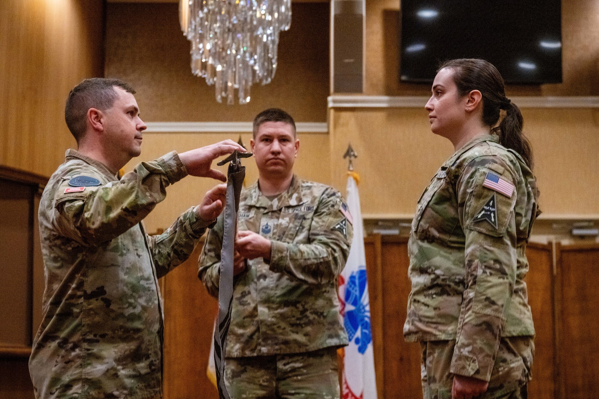 U.S. Space Force Lt. Col. Michael Provencher, 5th Space Warning Squadron (SWS) commander, unfurls the 5th SWS Detachment 4 guidon during an activation and assumption of command ceremony at Misawa Air Base, Japan, Oct. 25, 2023.