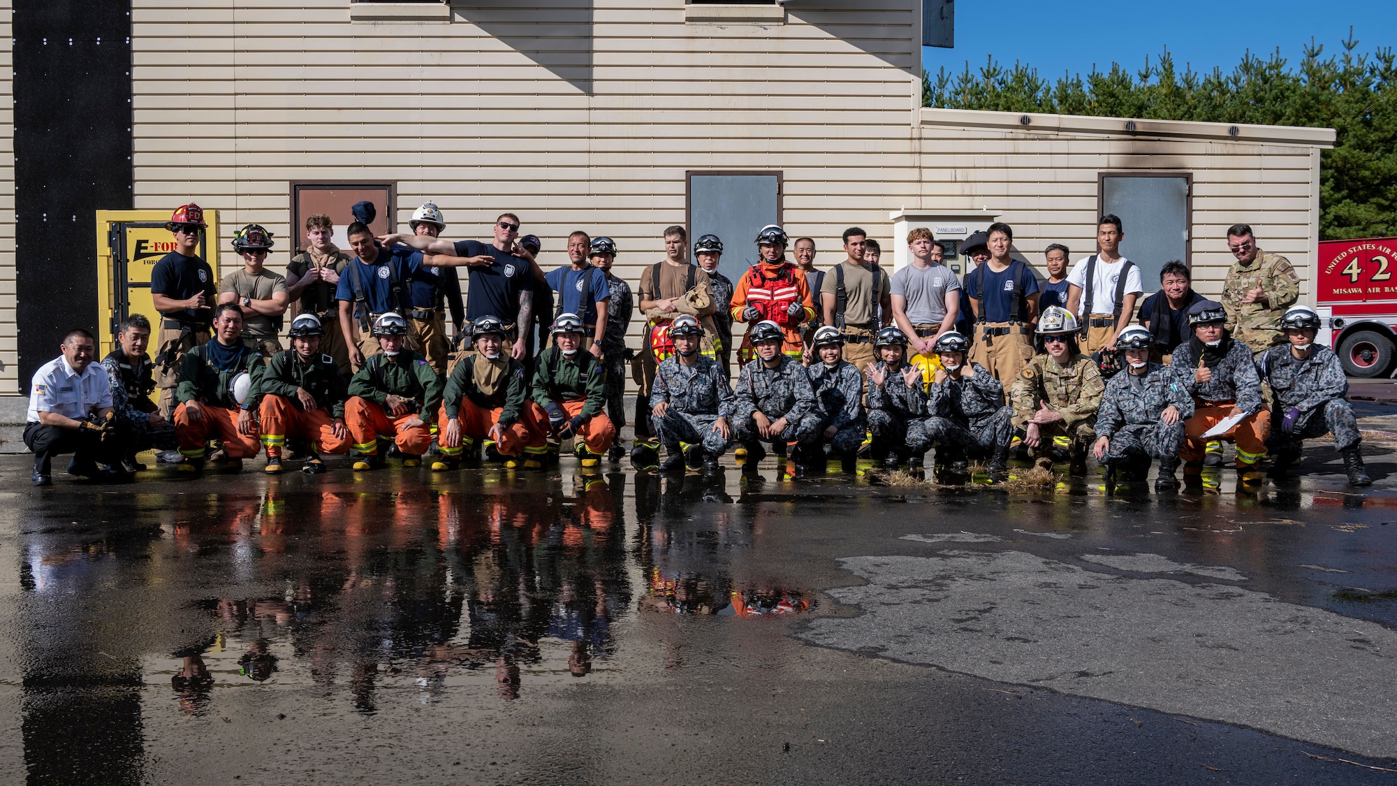 A group of people pose for a group photo.