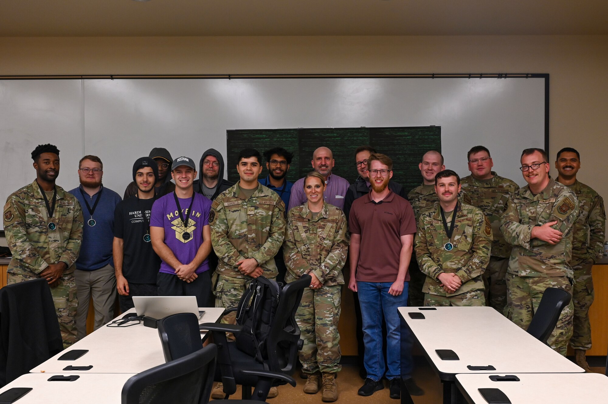 Members from Dyess and Hardin-Simmons University pose for a group photo at the end of the Hackathon event on Dyess Air Force Base, Texas, Oct. 26, 2023. The Hackathon was the first of its kind at Dyess. Airmen learned new skills in hacking and server creation to bring more multi-capable Airmen to the force while strengthening Dyess’ partnership with HSU. (U.S. Air Force photo by Senior Airman Sophia Robello)
