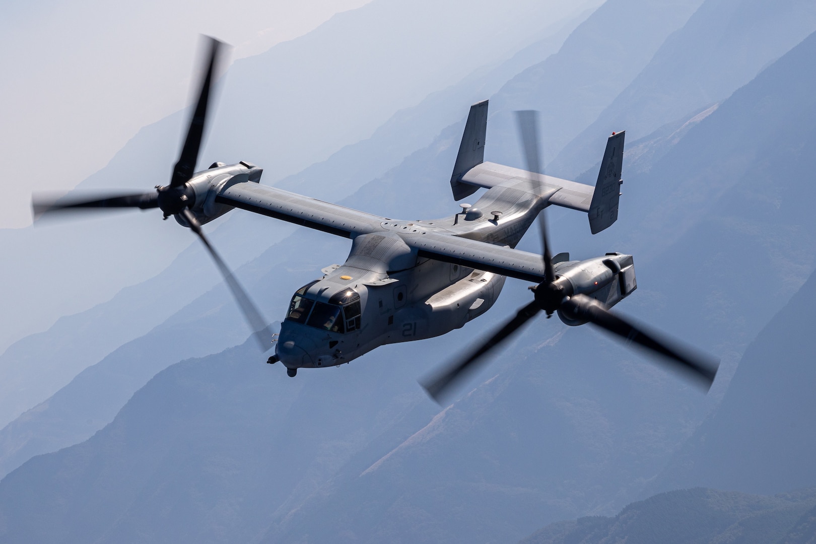 A U.S. Marine Corps MV-22 Osprey tiltrotor aircraft with Marine Medium Tiltrotor Squadron (VMM) 262, Marine Aircraft Group 36, 1st Marine Aircraft Wing, conducts a bilateral formation flight alongside Japan Ground Self-Defense Force service members with Western Army Aviation Group during the field training exercise portion of Resolute Dragon 23 off the coast of Kumamoto, Japan, Oct. 18, 2023. RD 23 is an annual bilateral exercise in Japan that strengthens the command, control, and multi-domain maneuver capabilities of Marines in III Marine Expeditionary Force and allied Japan Self-Defense Force personnel. (U.S. Marine Corps photo by Cpl. Kyle Chan)