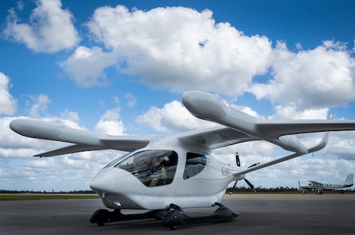 BETA’s ALIA electric aircraft has a 50-foot wingspan, a range of 250 miles with a top speed of 138 mph and is 90% quieter than a helicopter. While ALIA has the capability to transport five passengers, the Air Force test objective is to demonstrate its potential to support agile combat employment logistics with its payload capacity of 1,000 pounds. (U.S. Air Force photo by Samuel King Jr.)