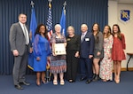 The Hall of Honors inductees and family members of deceased inductee pose during the Hall of Honor Ceremony, Oct. 20, 2023, at JBSA-Lackland, Texas.