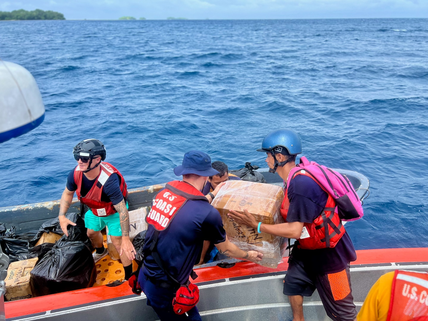 The USCGC Oliver Henry (WPC 1140) crew deliver supplies and the principal to Nukuoro, an atoll in the Federated States of Micronesia on Sept. 24, 2023. The team returned to homeport on Oct. 15 after a 28-day patrol that reinforced the U.S. commitment to sovereignty and resource security in the Federated States of Micronesia Exclusive Economic Zone (EEZ) and beyond. The mission, which was part of Operation Rematau and the broader U.S. Coast Guard's Operation Blue Pacific, fortifies the U.S. reputation as a reliable, trusted partner in the region. (U.S. Coast Guard photo by Petty Officer 2nd Class Breandan Muldowney)