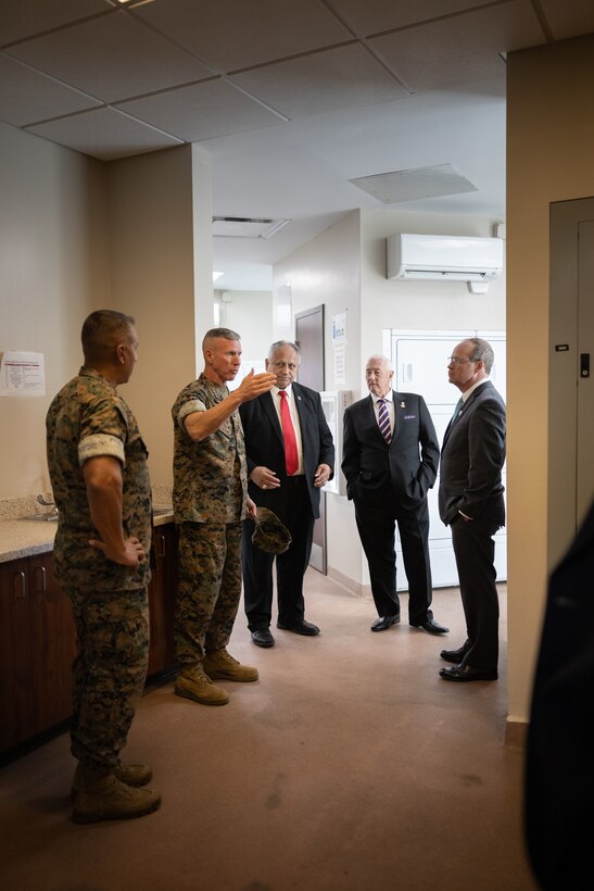 The 39th Commandant of the Marine Corps, Gen. Eric M. Smith , center left, speaks to Secretary of the Navy Carlos Del Toro, Marine leaders and congressional representatives during a tour of barracks facilities on Marine Corps Base (MCB) Camp Lejeune, North Carolina, Oct. 23, 2023. The Secretary of the Navy and Commandant of the Marine Corps met with Marines and Sailors before touring barracks across MCB Camp Lejeune to gain a better understanding of living conditions and requirements to improve facilities across the Marine Corps. (U.S. Marine Corps photo by Cpl. Antonino Mazzamuto)