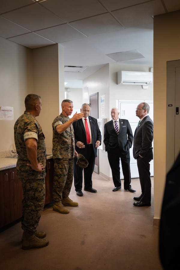 The 39th Commandant of the Marine Corps, Gen. Eric M. Smith , center left, speaks to Secretary of the Navy Carlos Del Toro, Marine leaders and congressional representatives during a tour of barracks facilities on Marine Corps Base (MCB) Camp Lejeune, North Carolina, Oct. 23, 2023. The Secretary of the Navy and Commandant of the Marine Corps met with Marines and Sailors before touring barracks across MCB Camp Lejeune to gain a better understanding of living conditions and requirements to improve facilities across the Marine Corps. (U.S. Marine Corps photo by Cpl. Antonino Mazzamuto)