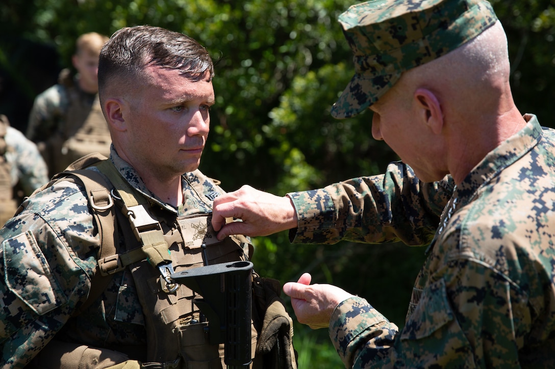 U.S. Marine Cpl. Peyton Nott is promoted to sergeant, meritoriously, by the 36th Assistant Commandant of the Marine Corps, Gen. Eric M. Smith, on Camp Lejeune, July 25, 2023. Nott is the acting motor transportation chief with Romeo Battery, 1st Battalion, 10th Marine Regiment, and was promoted as a result of his exceptional performance and leadership while holding a billet reserved for a gunnery sergeant. (U.S. Marine Corps photo by Sgt. Rachaelanne Woodward)