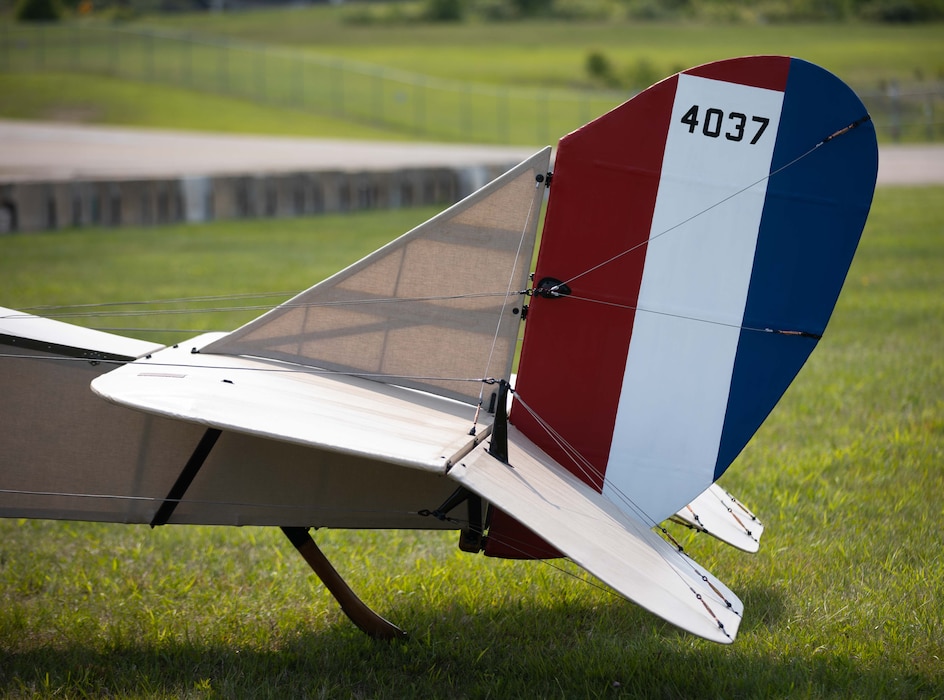 an image of just the tail of the jenny, featuring the vertical red, white and blue stripe with the number 4037 in black.