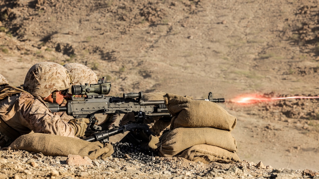 U.S. Marine Corps Lance Cpl. Michael Melkonyan, a machine gunner assigned to Charlie Company, Battalion Landing Team 1/5, 15th Marine Expeditionary Unit, fires an M240B machine gun while conducting Range 410A at Marine Corps Air-Ground Combat Center, Twentynine Palms, California, Sept. 12, 2023. Range 410A is a platoon live-fire and maneuver combined arms attack range designed to train units in tactics, techniques, and procedures required to provide a sustainable and operational unit across the conflict continuum.