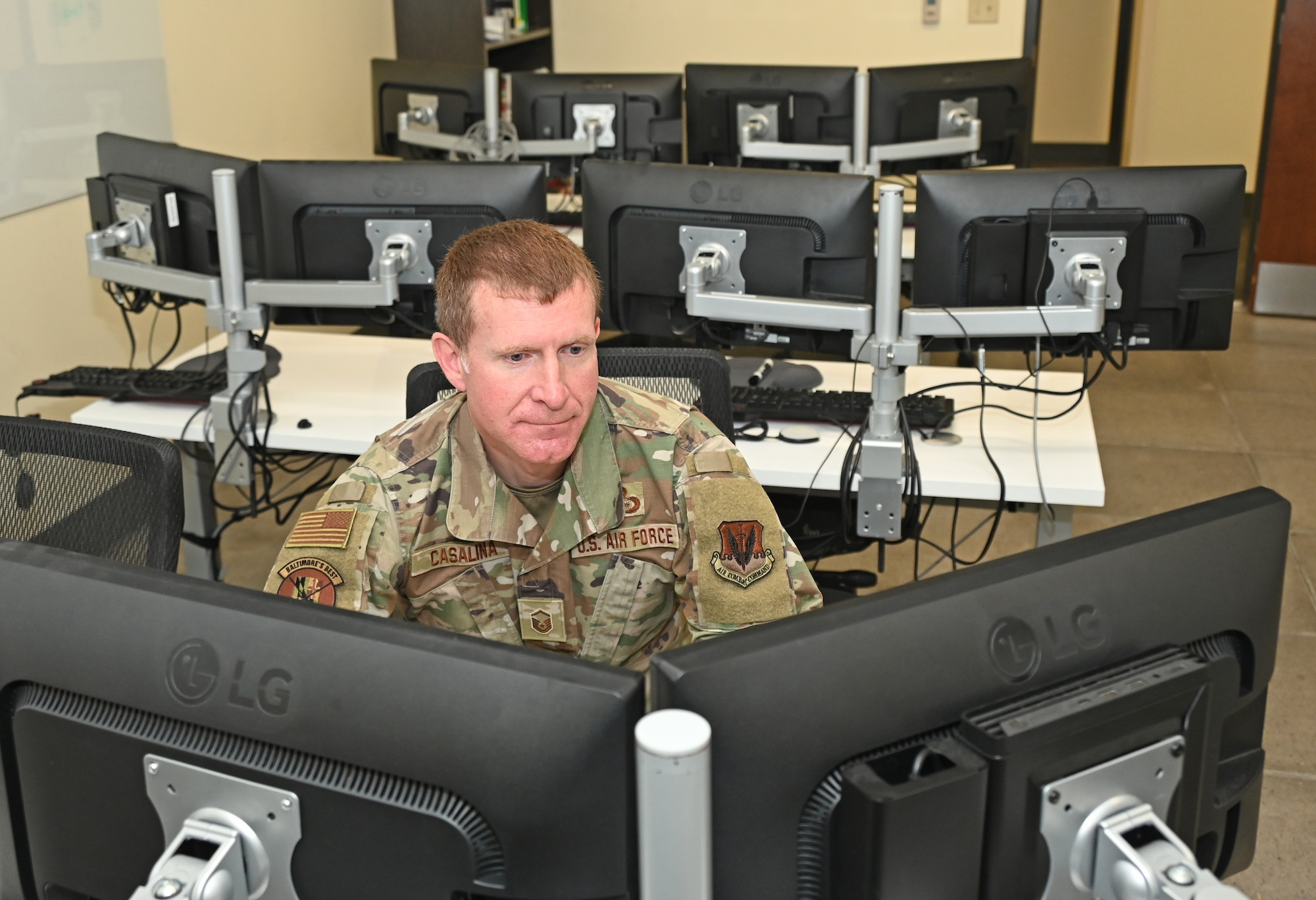 Maryland Air National Guard Master Sgt. Benny Casalina, a network intelligence analyst assigned to the 135th Intelligence Squadron, Maryland Air National Guard, works at a computer terminal at Martin State Air National Guard Base, Middle River, Md., October 27, 2023.