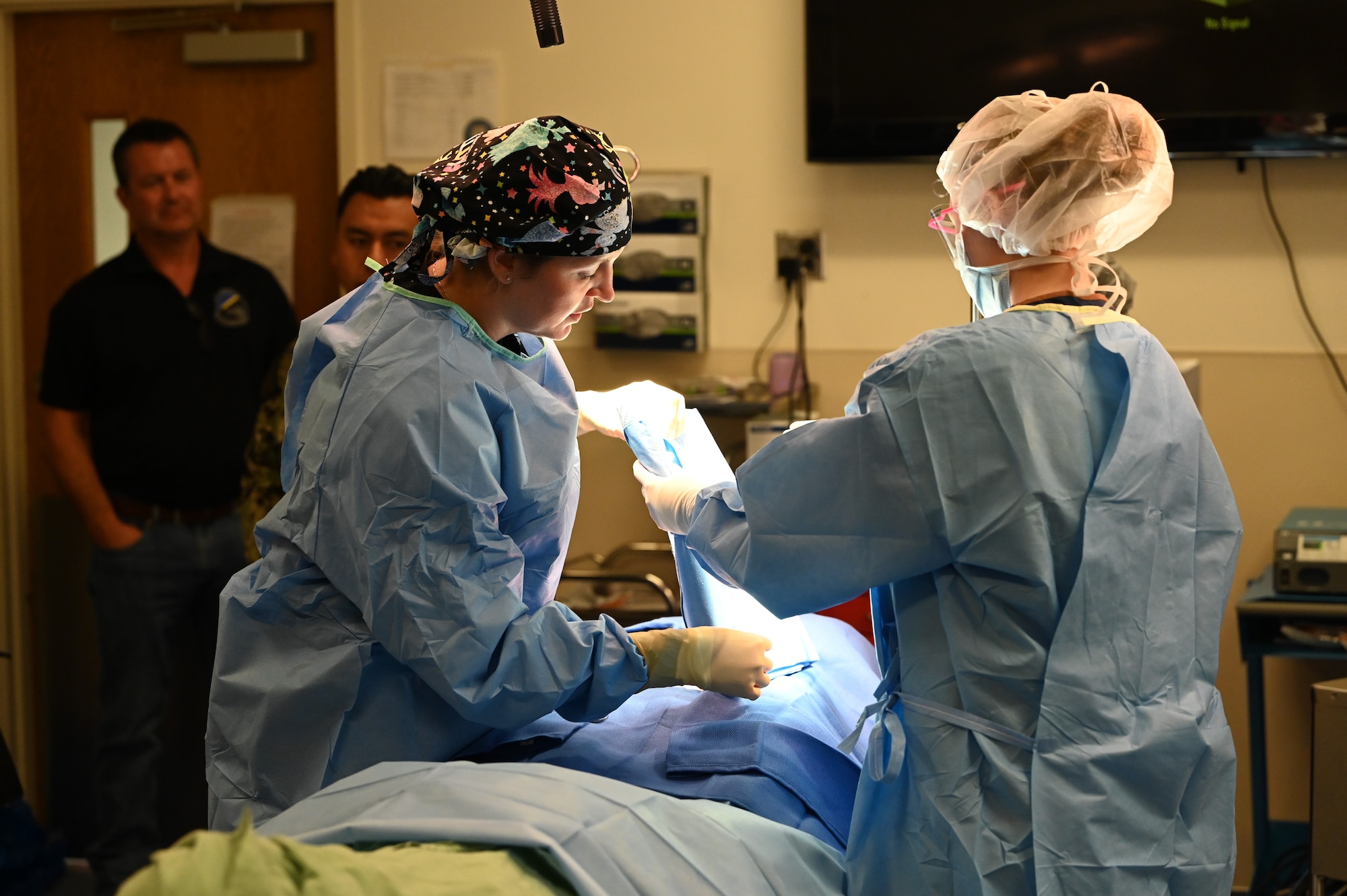 Twenty-two Dayton, Ohio civic leaders watch a mock surgery being performed while visiting the Medical and Education Training Campus at Joint Base San Antonio-Fort Sam Houston, Texas Oct. 19, 2023. The 445th Airlift Wing hosted Dayton-area civic leaders in conjunction with the 433rd Airlift Wing at Joint Base San Antonio-Lackland, Texas, Oct. 18-19 at Wright-Patterson Air Force Base, Ohio and San Antonio. (U.S. Air Force photo/Master Sgt. Patrick O’Reilly)