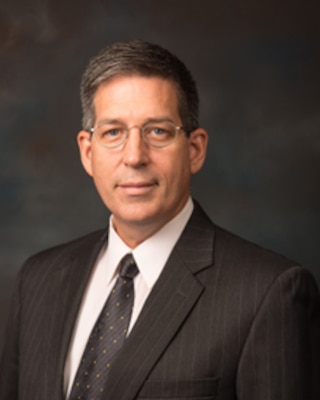 Dr. Clark Groves Biography Photo
