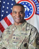 Army Officer in front of U.S. Flag and USAREC flag