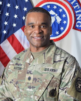 Army Officer in front of U.S. Flag and USAREC flag