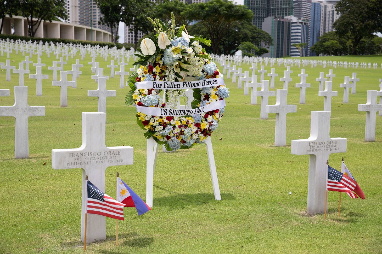 Headstones of Filipino-American brothers during a wreath laying event at the Manila American Cemetery and Memorial in the Philippines, Aug. 27. U.S. 7th Fleet is the U.S. Navy's largest forward-deployed numbered fleet, and routinely interacts and operates with allies and partners in preserving a free and open Indo-Pacific region.