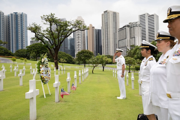 Commander, U.S. 7th Fleet Vice Admiral Karl Thomas salutes the headstones of Filipino-American brothers during a wreath laying event at the Manila American Cemetery and Memorial in the Philippines, Aug. 27. U.S. 7th Fleet is the U.S. Navy's largest forward-deployed numbered fleet, and routinely interacts and operates with allies and partners in preserving a free and open Indo-Pacific region.