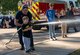 Lt. Jason Winters, 733d Civil Engineer Squadron firefighter, demonstrates how to safely use a fire hose during the final night of Fire Prevention Week at Joint Base Langley-Eustis, Virginia, Oct. 13, 2023.