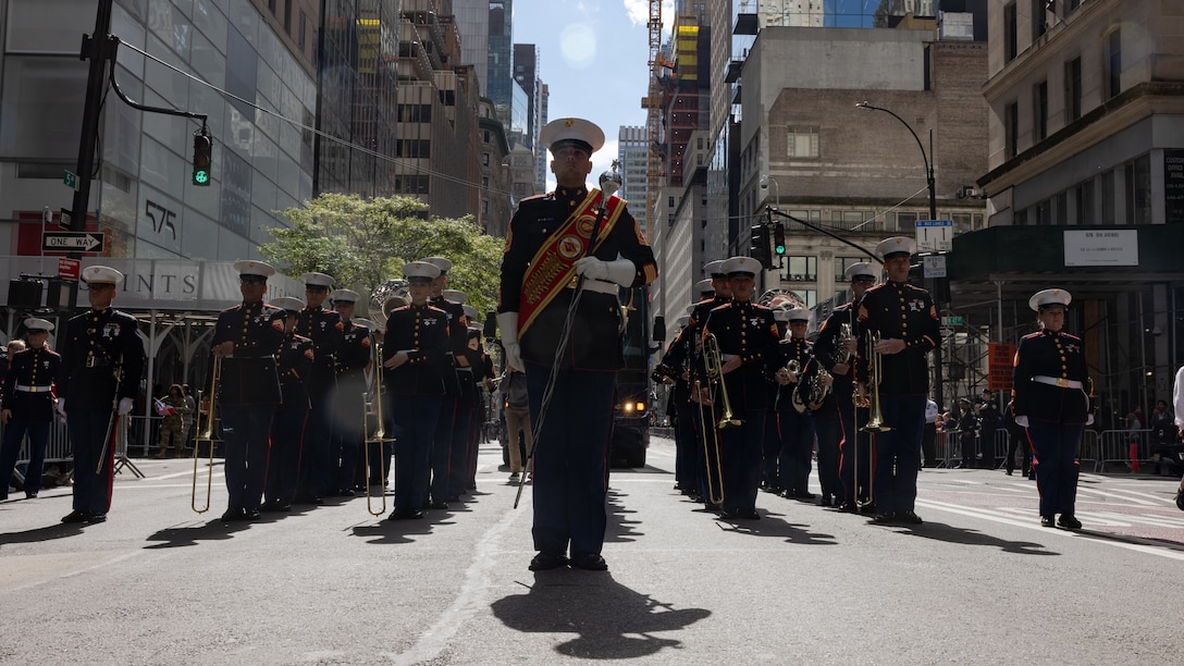 U.S. Marines with the 2nd Marine Aircraft Wing (MAW) Band stand in formation during the 79th Annual Columbus Day Parade at Manhattan, New York, Oct. 9, 2023. Marines with the 2nd MAW Band performed during the 79th Annual Columbus Day Parade to strengthen community relationships and reaffirm history, customs, and traditions representative of the United States Marine Corps to those in attendance. 2nd MAW is the aviation combat element of II Marine Expeditionary Force. (U.S. Marine Corps photo by Lance Cpl. Orlanys Diaz Figueroa)